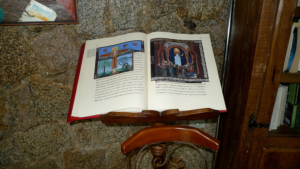 A book on a wooden stand.